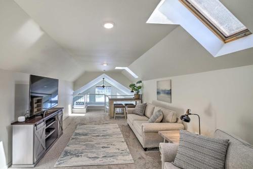 a living room with a couch and a table at The Rookery - Dreamy Home with Private Dock! in Yelm