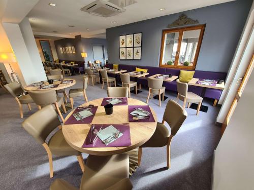 a dining room with a table and chairs at Best Western Plus Hotel & SPA Le Schoenenbourg in Riquewihr