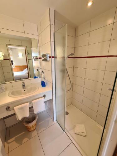 a bathroom with a shower and a sink at Best Western Plus Hotel & SPA Le Schoenenbourg in Riquewihr