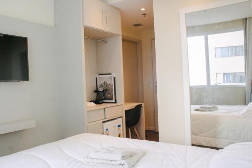 Ein Bett oder Betten in einem Zimmer der Unterkunft Apart-hotel TrueAmérica