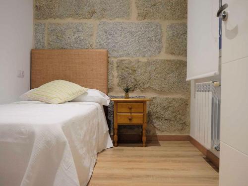 Ένα ή περισσότερα κρεβάτια σε δωμάτιο στο Apartment in Ourense near Hot Springs