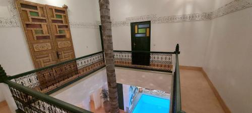 an empty room with a door and a balcony at Riad Celia in Marrakech