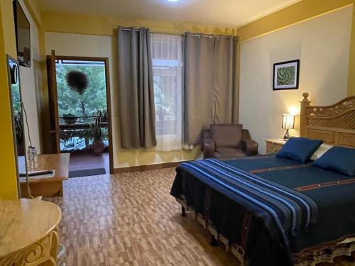 Postel nebo postele na pokoji v ubytování Hotel-Villas JABEL TINAMIT