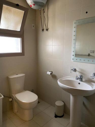 a bathroom with a toilet and a sink at Chalet at Little Venice - Ain Sokhna in Ain Sokhna