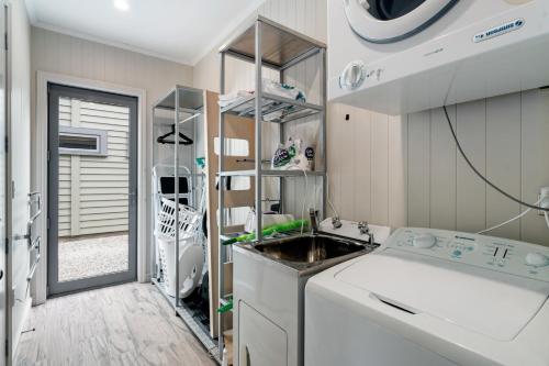 a kitchen with a sink in a room at Cardrona Cottage - Cardrona Holiday Home in Cardrona