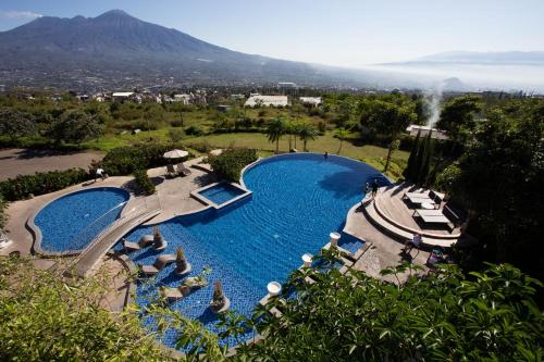 an overhead view of a swimming pool at a resort at Amartahills Hotel and Resort in Batu