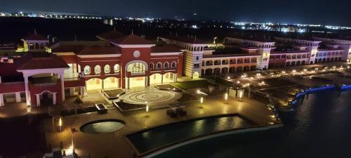 a view of a large building at night at Apartment in Porto Sharm VIP in Sharm El Sheikh