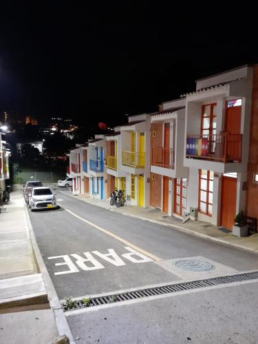 an empty street with a row of buildings at night at Casa Villa Paz Salento in Salento