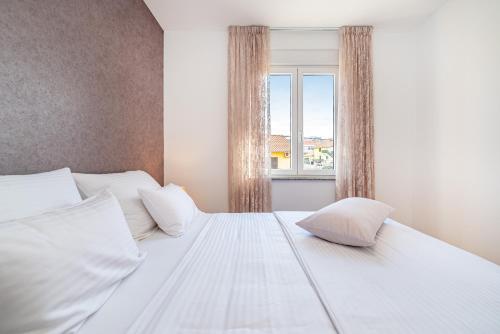 Posteľ alebo postele v izbe v ubytovaní Apartment Oasis