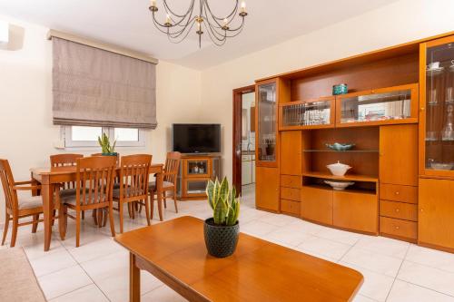 a living room with a table and a dining room at Ninemia Studios in Limenas