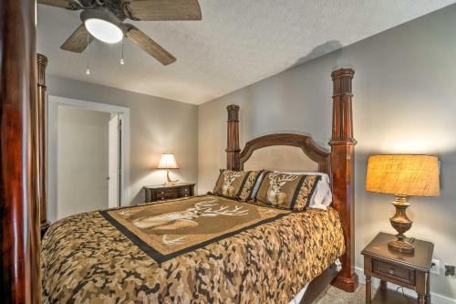 a bedroom with a bed and two night stands with lamps at Bright Green Gables Cabin Hike, Swim and BBQ in Lewisburg