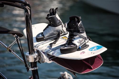 a pair of shoes sitting on top of a surfboard at Hotel Eden Roc - The Leading Hotels of the World in Ascona