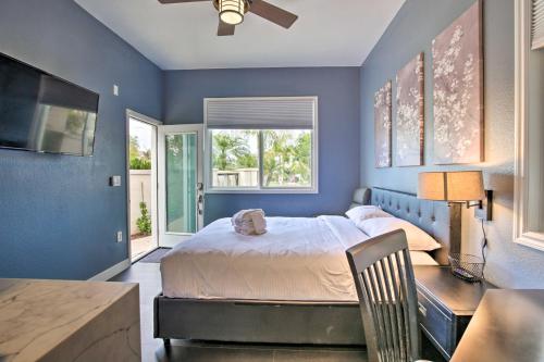 a bedroom with a bed and a desk and a window at Torrey Spa Suite Modern San Diego Studio! in San Diego