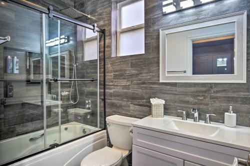 a bathroom with a toilet and a sink and a shower at Torrey Spa Suite Modern San Diego Studio! in San Diego