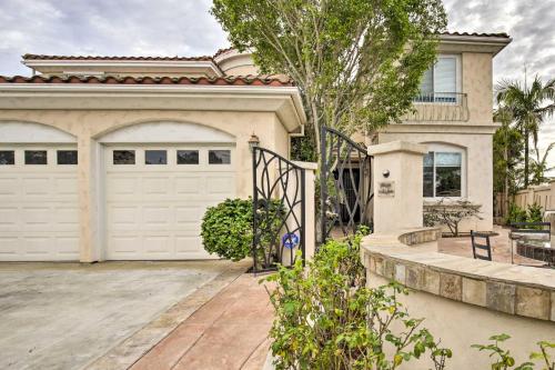 a house with a white garage door and a driveway at Torrey Spa Suite Modern San Diego Studio! in San Diego