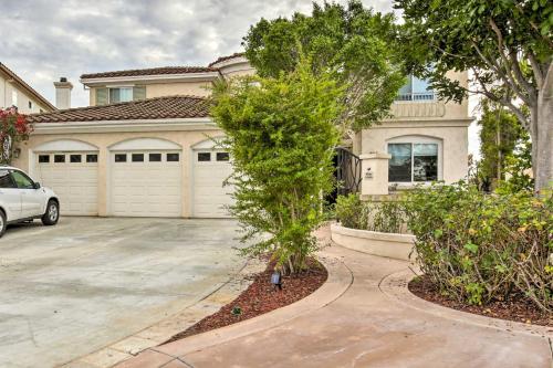 a house with a car parked in a driveway at Torrey Spa Suite Modern San Diego Studio! in San Diego