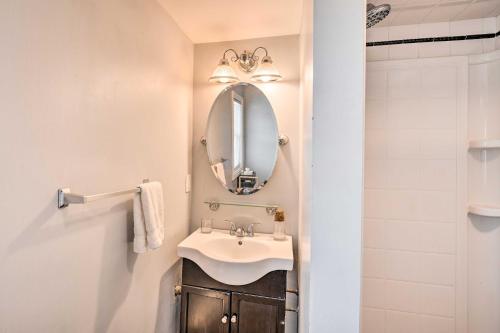 a bathroom with a sink and a mirror at Bright Belmar Cottage Less Than Half Mi to Boardwalk! in Belmar