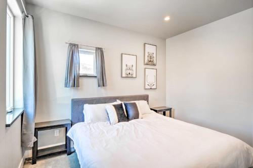 a bedroom with a bed with white sheets and pillows at Alma Retreat with Mtn Views about 17 Mi to Breck! in Alma