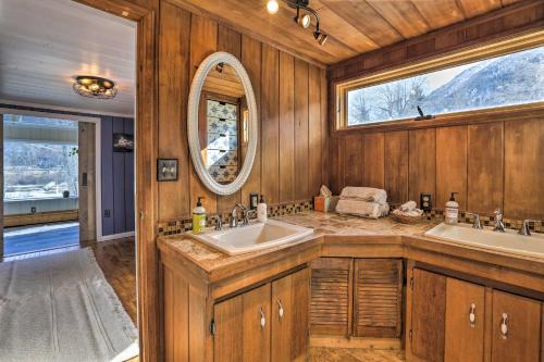 a bathroom with two sinks and a mirror at Lake Cabin with King Bed, Foodie Kitchen, and Views in Twin Lakes