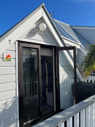 a screened in porch on a house at The Jazz Loft in Onetangi