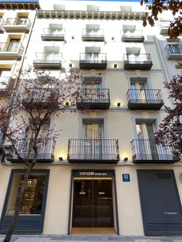 a white building with balconies on the side of it at AZ Hotel San Valero in Zaragoza