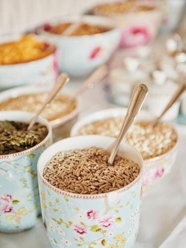 a group of bowls filled with seeds on a table at Grand Hotel Jonkoping, BW Signature Collection in Jönköping