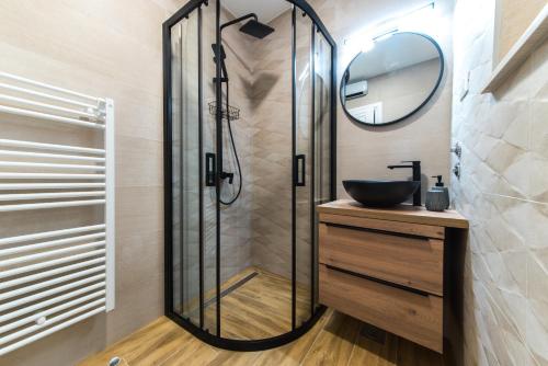 a bathroom with a sink and a shower at Villa Divić in Baška Voda