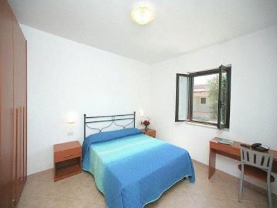Säng eller sängar i ett rum på Santa Maria villaggio turistico