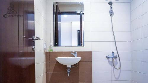 a bathroom with a sink and a shower at Regentown Near ICE BSD in Tangerang