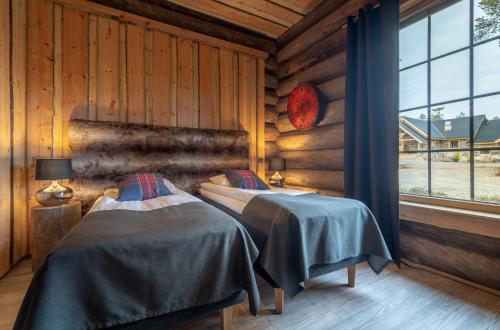 Postel nebo postele na pokoji v ubytování Wilderness Hotel Nangu & Igloos