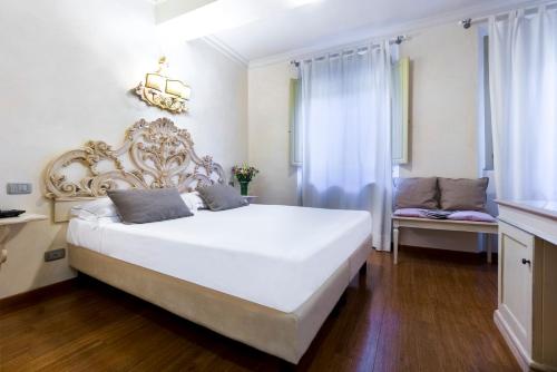Ένα ή περισσότερα κρεβάτια σε δωμάτιο στο Hotel Art Atelier - Place of Charme