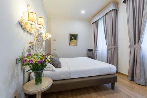 Ένα ή περισσότερα κρεβάτια σε δωμάτιο στο Hotel Art Atelier - Place of Charme