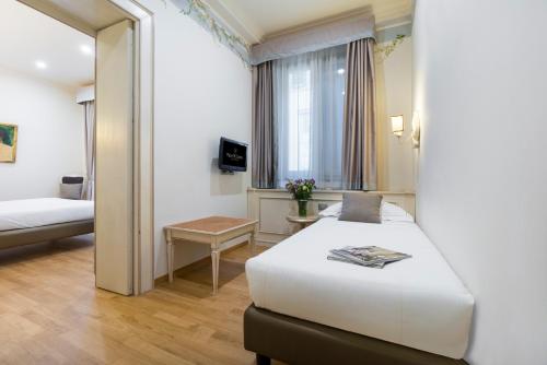 Ένα ή περισσότερα κρεβάτια σε δωμάτιο στο Hotel Art Atelier - Place of Charme