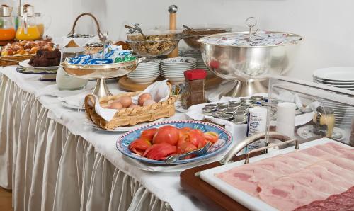 a table with a buffet of food on it at Hotel L'Ancora in Positano