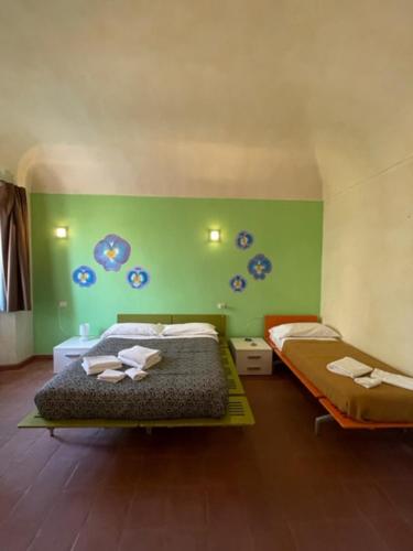 A bed or beds in a room at Foresteria La Rubbianetta