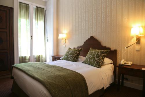 Ένα ή περισσότερα κρεβάτια σε δωμάτιο στο Hotel Dom Sancho I