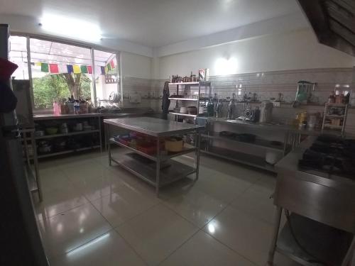 a kitchen with a table in the middle of a room at Green Mandala Inn in Kathmandu