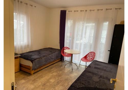 Ένα ή περισσότερα κρεβάτια σε δωμάτιο στο Villa Dada
