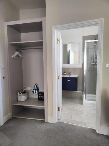 a bathroom with a sink and a mirror at St Johns Boutique Hotel in London