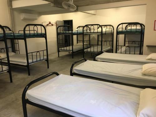 a group of bunk beds in a room at Ode to Joy in Serendah