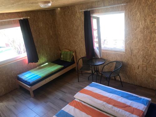 A bed or beds in a room at Tóparti Camping