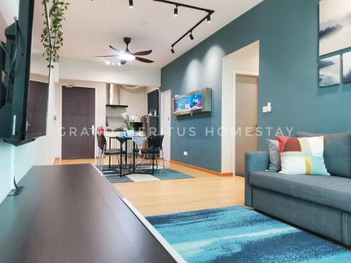 a living room with a couch and a table at Grand Meritus Homestay @Penang in Perai