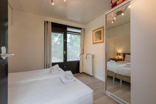 A bed or beds in a room at Appartement - Burg van Woelderenlaan 100-4 Vlissingen