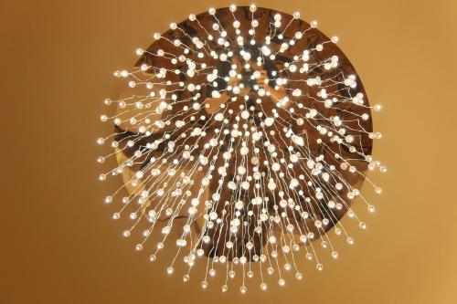 a bunch of white lights in a ball at Golden Tulip - Aesthetics in Zhunan