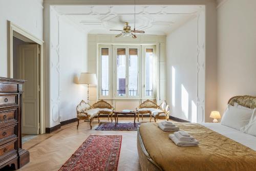 a bedroom with a bed and a table and chairs at CS Vatican Charming Apartment in Rome
