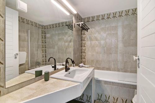Ένα μπάνιο στο Ocean View Apartment Hakuna Matata