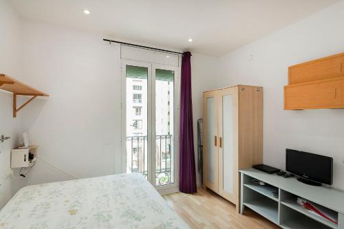 Posteľ alebo postele v izbe v ubytovaní SAGRADA FAMILIA APARTAMENT