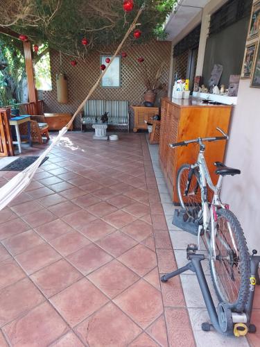 a bike parked on a patio with a counter at Casa familiar La Arboleda in Guatemala