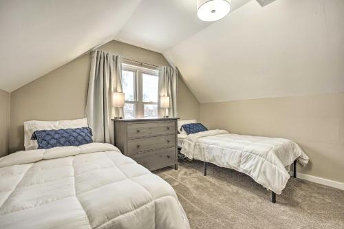 a bedroom with two beds and a window at Modern South Bend Getaway about 3 Mi to Downtown in South Bend