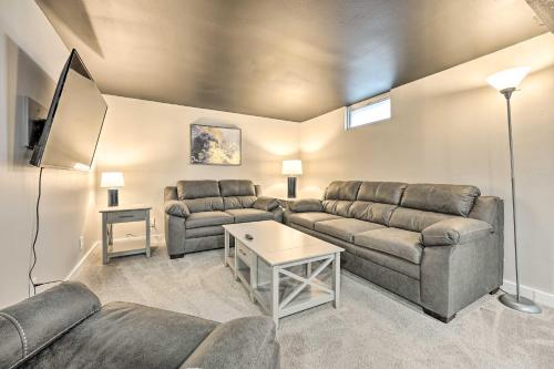 a living room with a couch and a table at Modern South Bend Getaway about 3 Mi to Downtown in South Bend